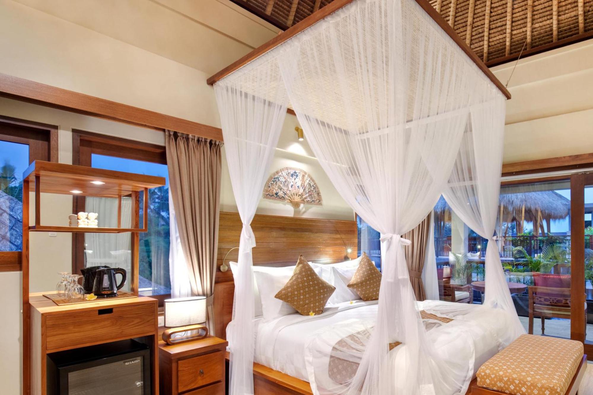 อูบุด นยูห์ บาหลี รีสอร์ต แอนด์ สปา Hotel ห้อง รูปภาพ A mosquito net over a bed